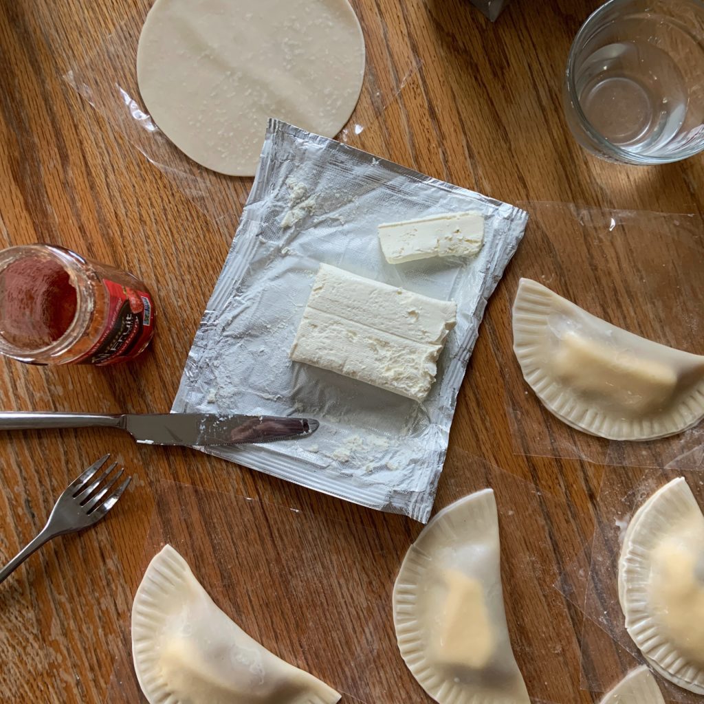 Making strawberry and cream cheese empanadas